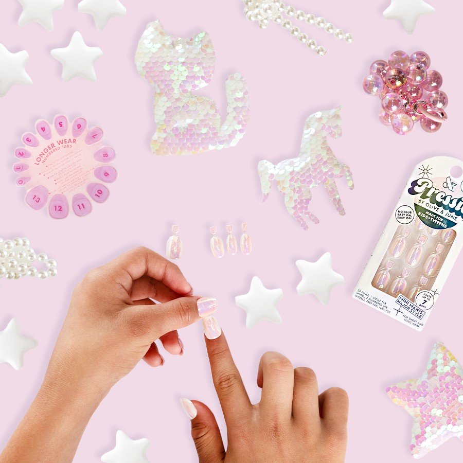 Cool in Chrome French - Pressies | Short Medium | Round showing iridescent chrome shimmer press-on nails on hands with decorative accents
