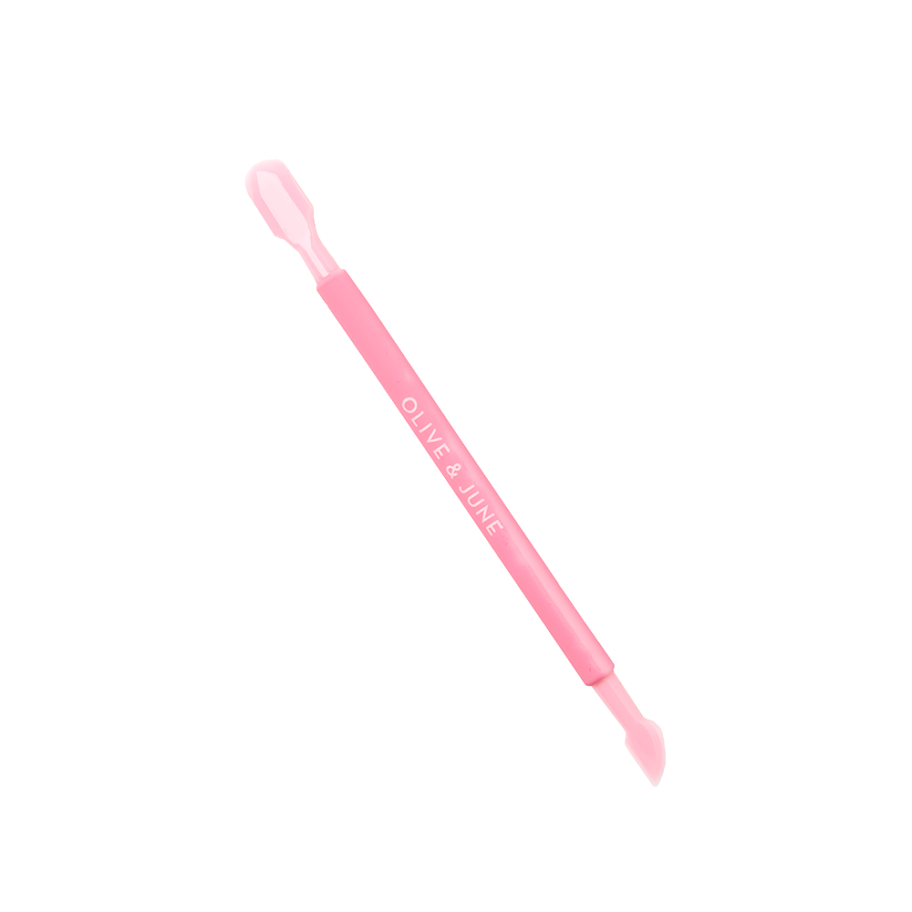 Mani Cuticle Pusher in pink with dual ends for gentle cuticle care and precise nail bed cleaning on white background
