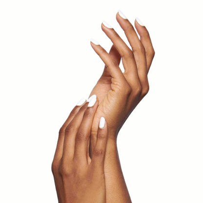 Hands with long nails painted in crisp white HD polish against a clean white background for manicure display