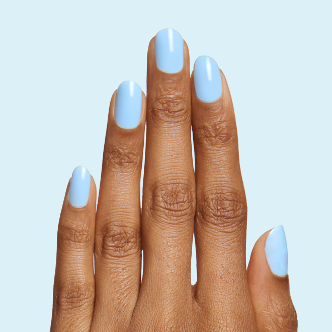 Hand displaying nails painted in Honest & True serene blue gel polish for a calm and long-lasting manicure