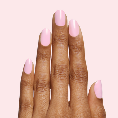 Hand with nails painted in soft bubbly pink shade SE for a fresh and sweet at-home manicure look
