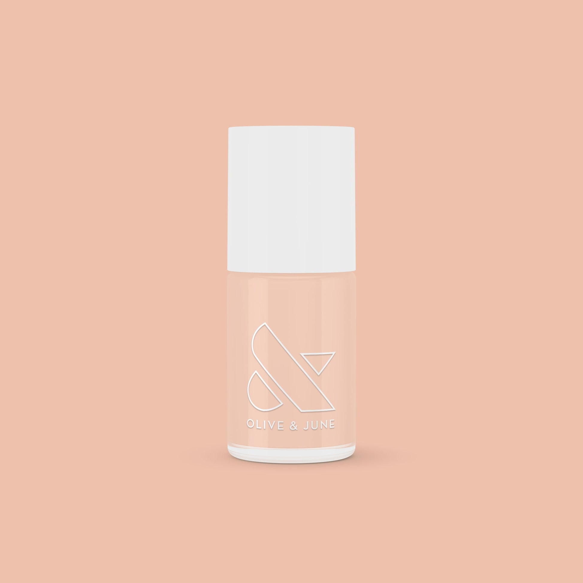 KAG nail polish bottle in neutral peachy pink shade on matching peach background for a fresh mani or pedi