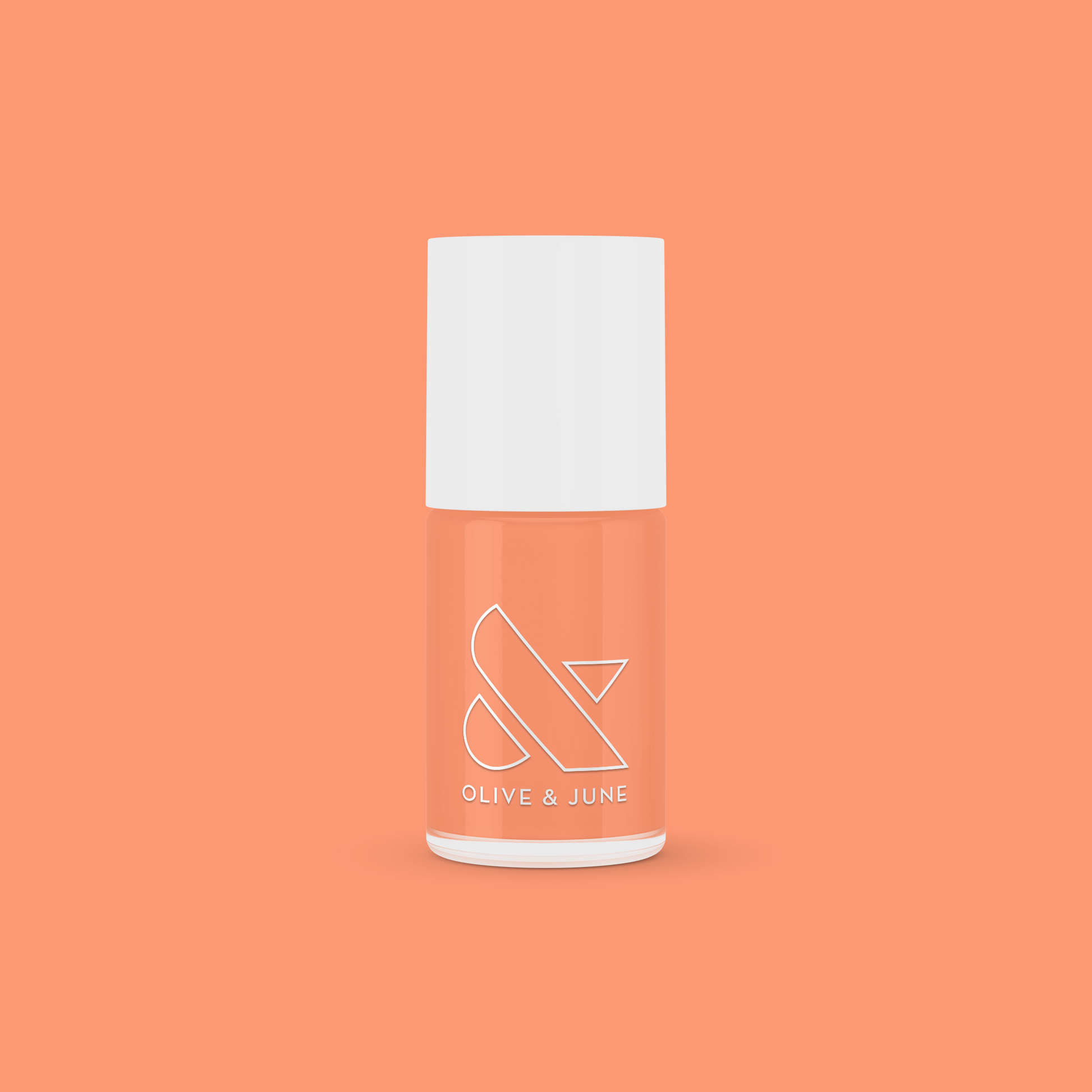 Olive and June Wild & Free gel polish bottle in fierce coral shade on a bright coral background for at-home mani.