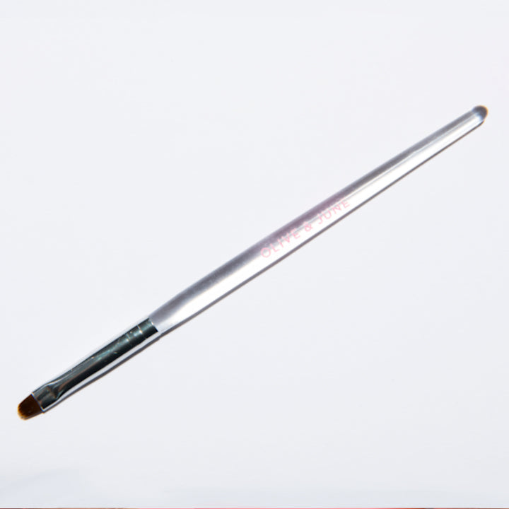 Clean Up Brush angled tip designed for precise polish clean up and creating sharp manicure edges at home