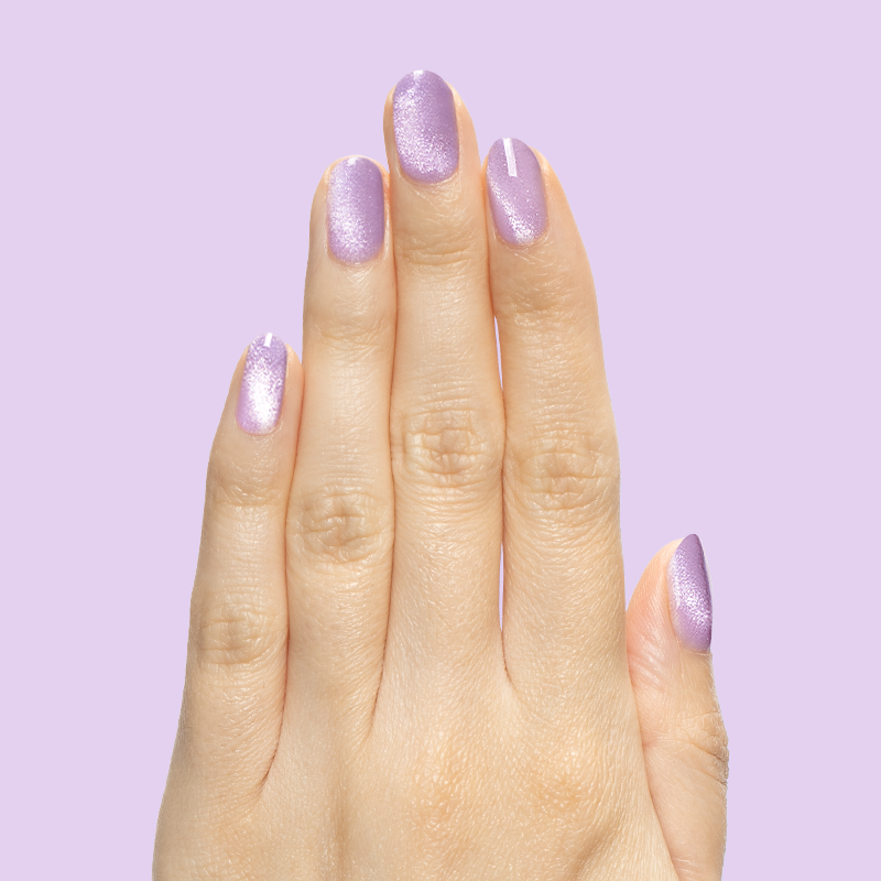 Hand with nails polished in Amethyst Velvet - Gel pastel lavender magnetic polish for at-home manicure look