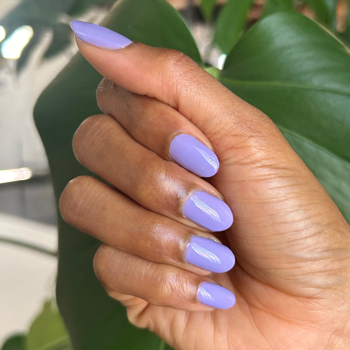 Bold & Unshaken - Gel shown on manicured nails in a smooth purple shade for a long-lasting gel polish mani by Olive and June
