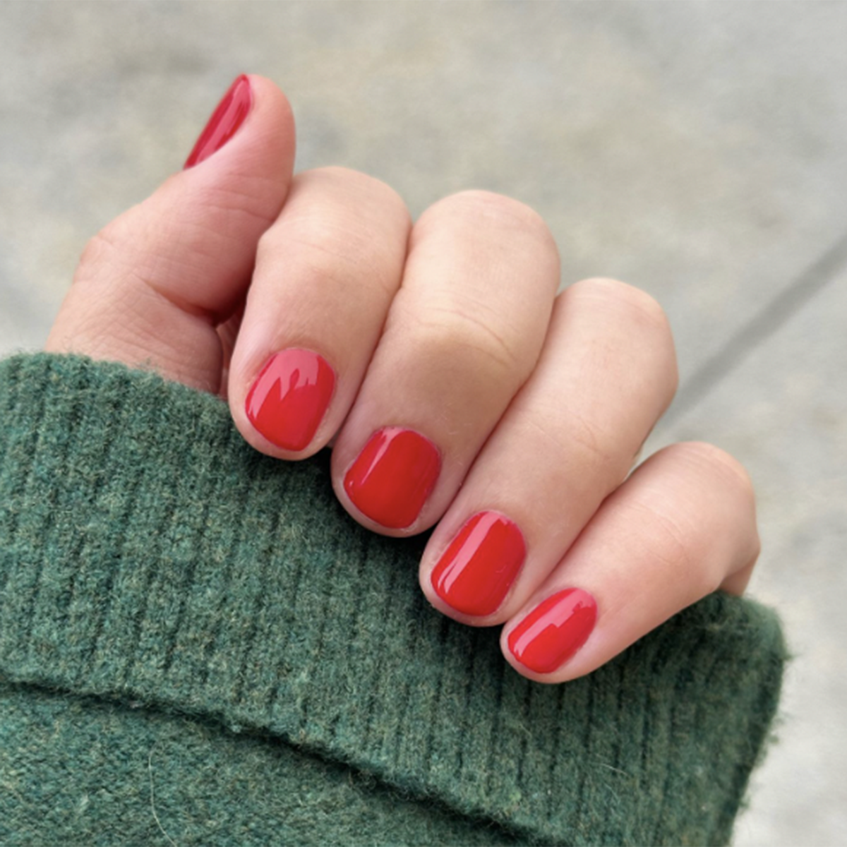 CV - Gel on natural nails in a bright cherry red shade for a glossy, long-lasting at-home manicure by Olive and June