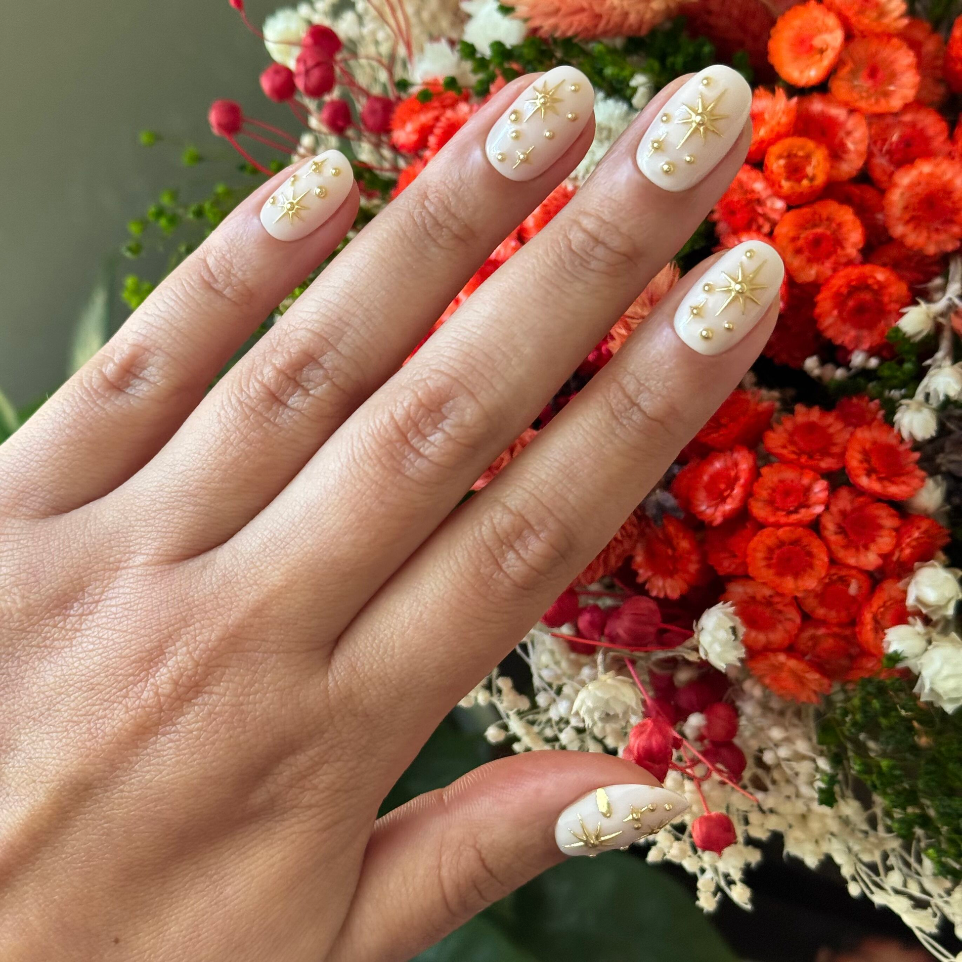 Confetti Sparkle - Press-On | Short | Round with milky base and gold star and dot accents for an easy at-home manicure