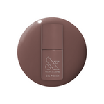 Olive and June Fawn - Gel polish bottle on a smooth swatch of warm brown neutral gel polish