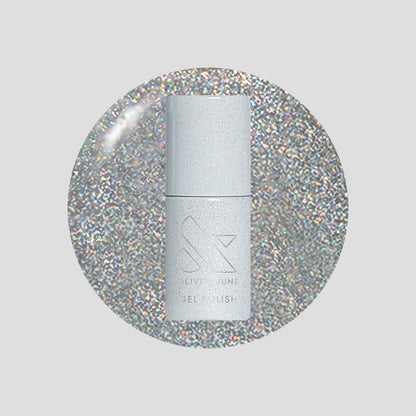 Glitter Department Gel bottle on a holographic silver glitter background for a festive at-home manicure by Olive and June