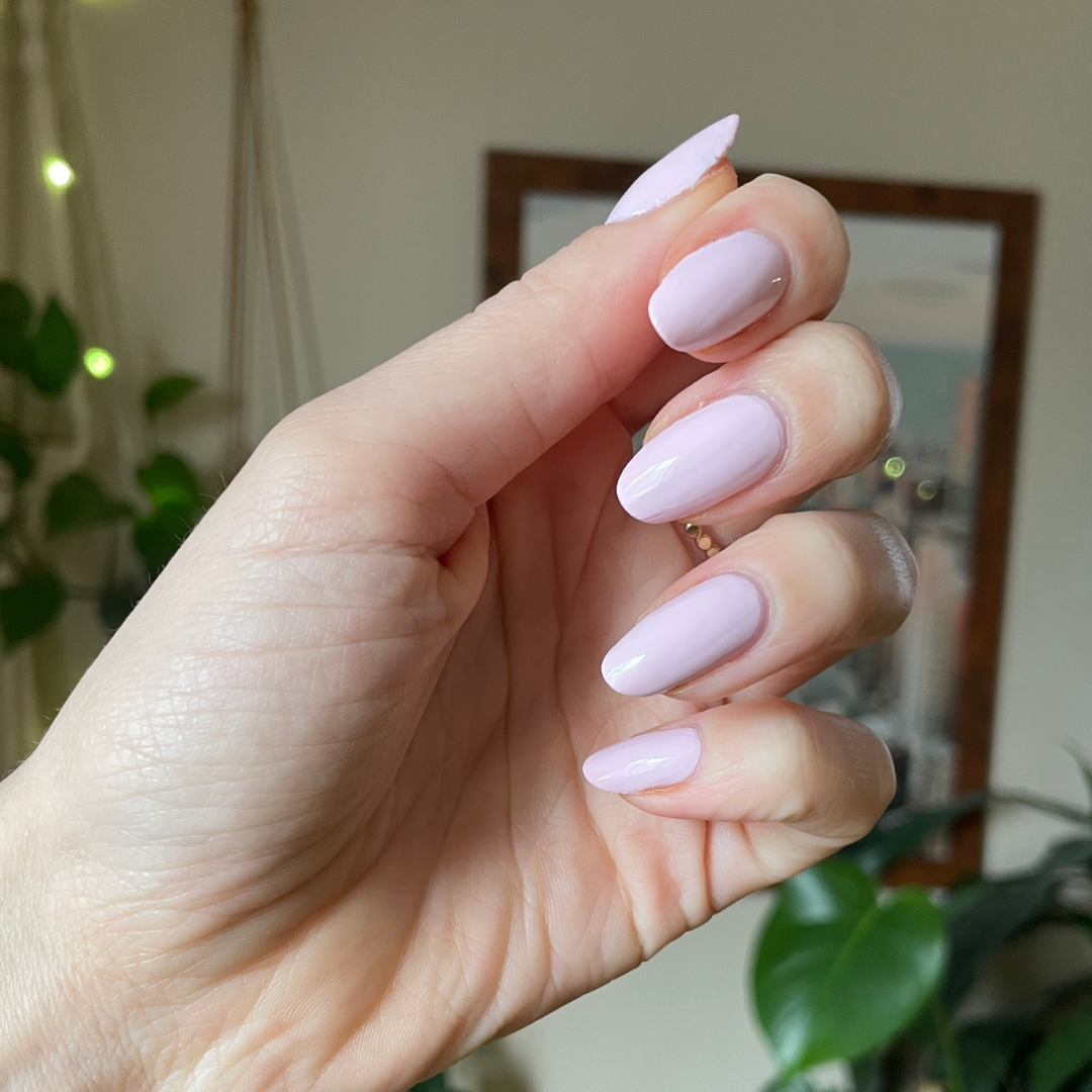 Hand with Gelato gel polish in soft baby pink on almond shaped nails for a smooth at home manicure look