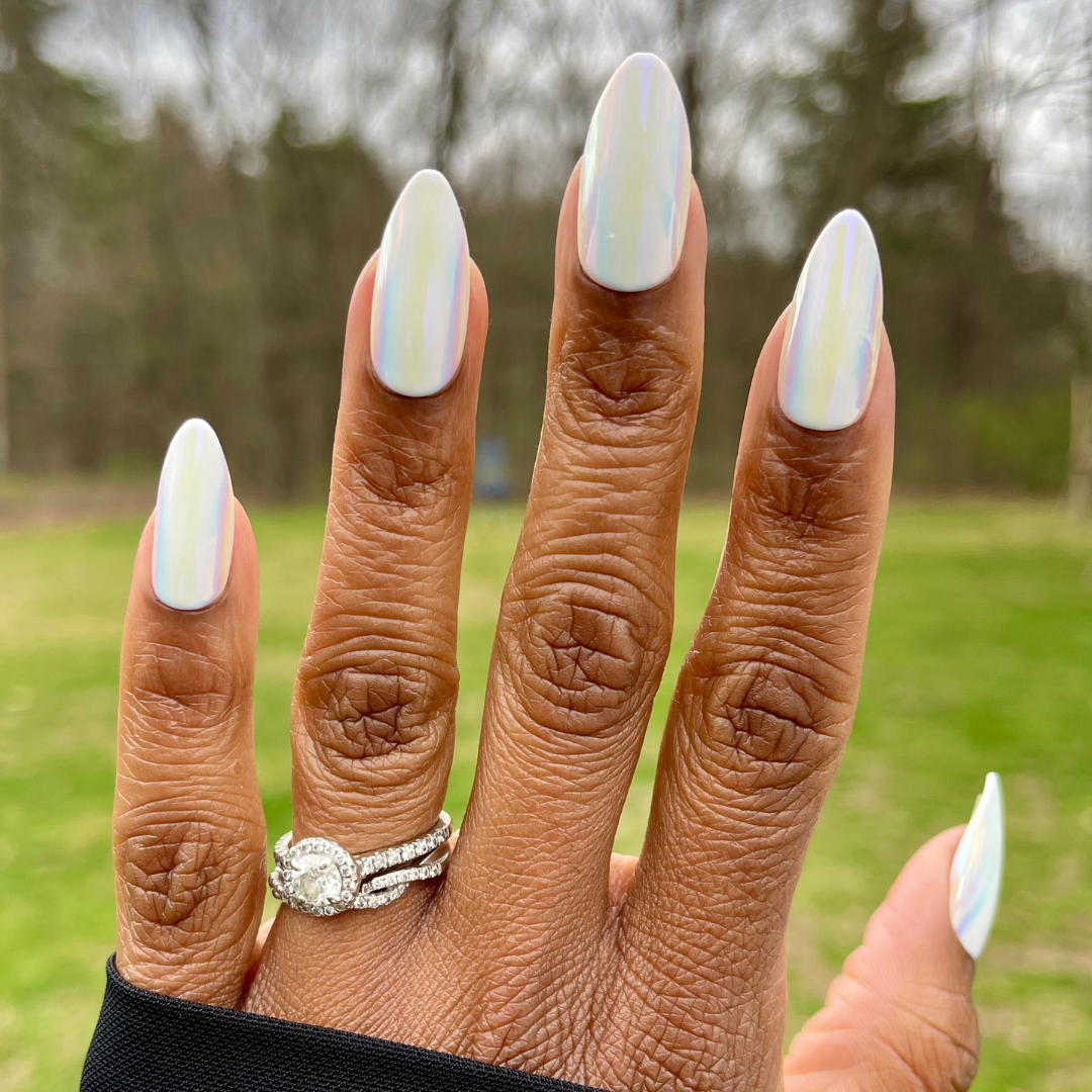Iridescent Chrome - Press-On | Long | Almond long false nails with shiny white iridescent chrome manicure on hand outdoors