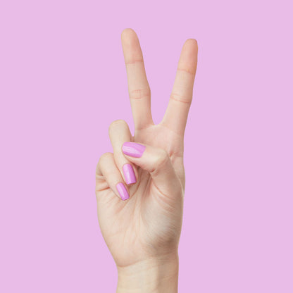 Hand showing peace sign with nails painted in glowing soft magenta Jam, Please polish for a shiny manicure