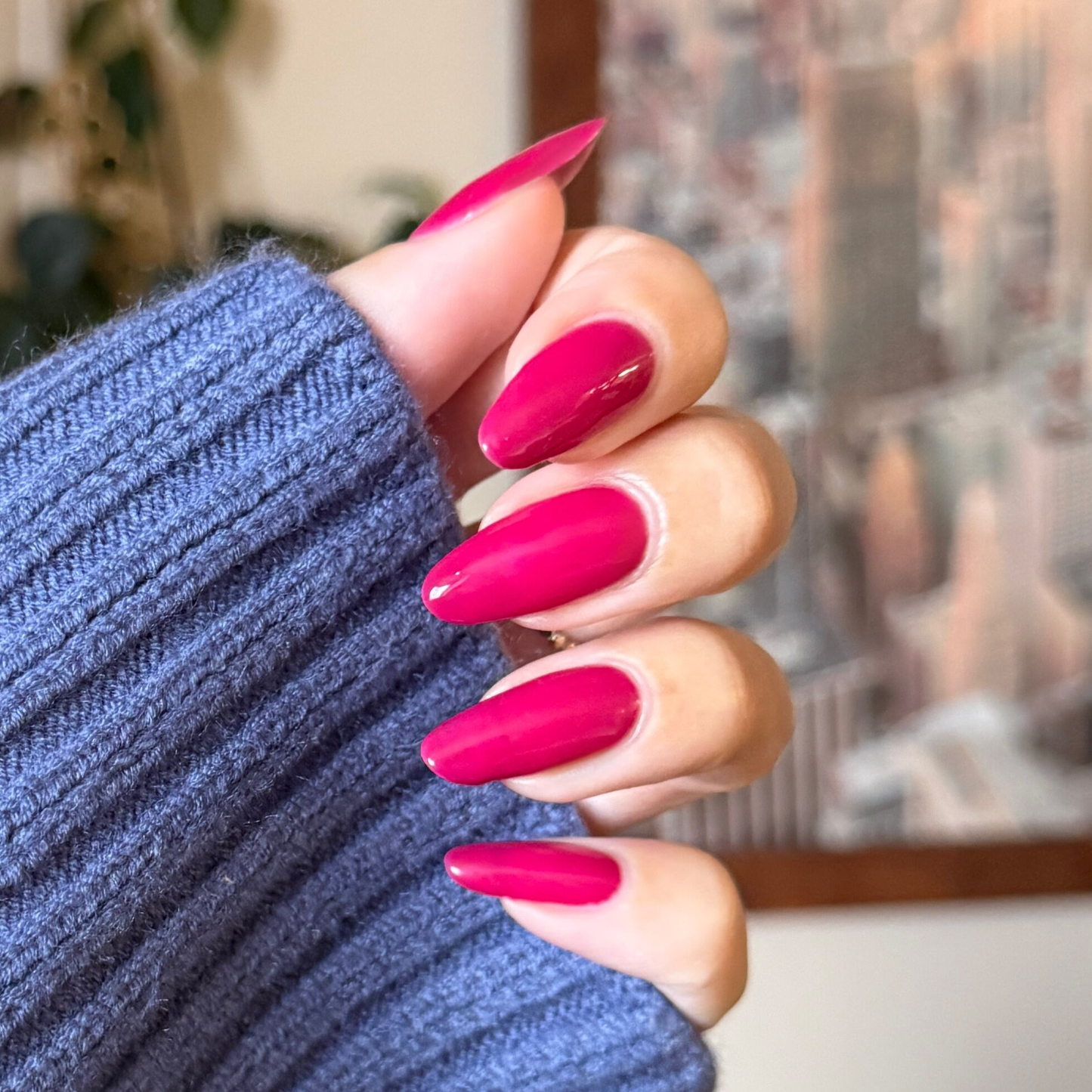 JG - Gel on long almond-shaped nails in a vivid berry shade for a polished, color-forward manicure by Olive and June
