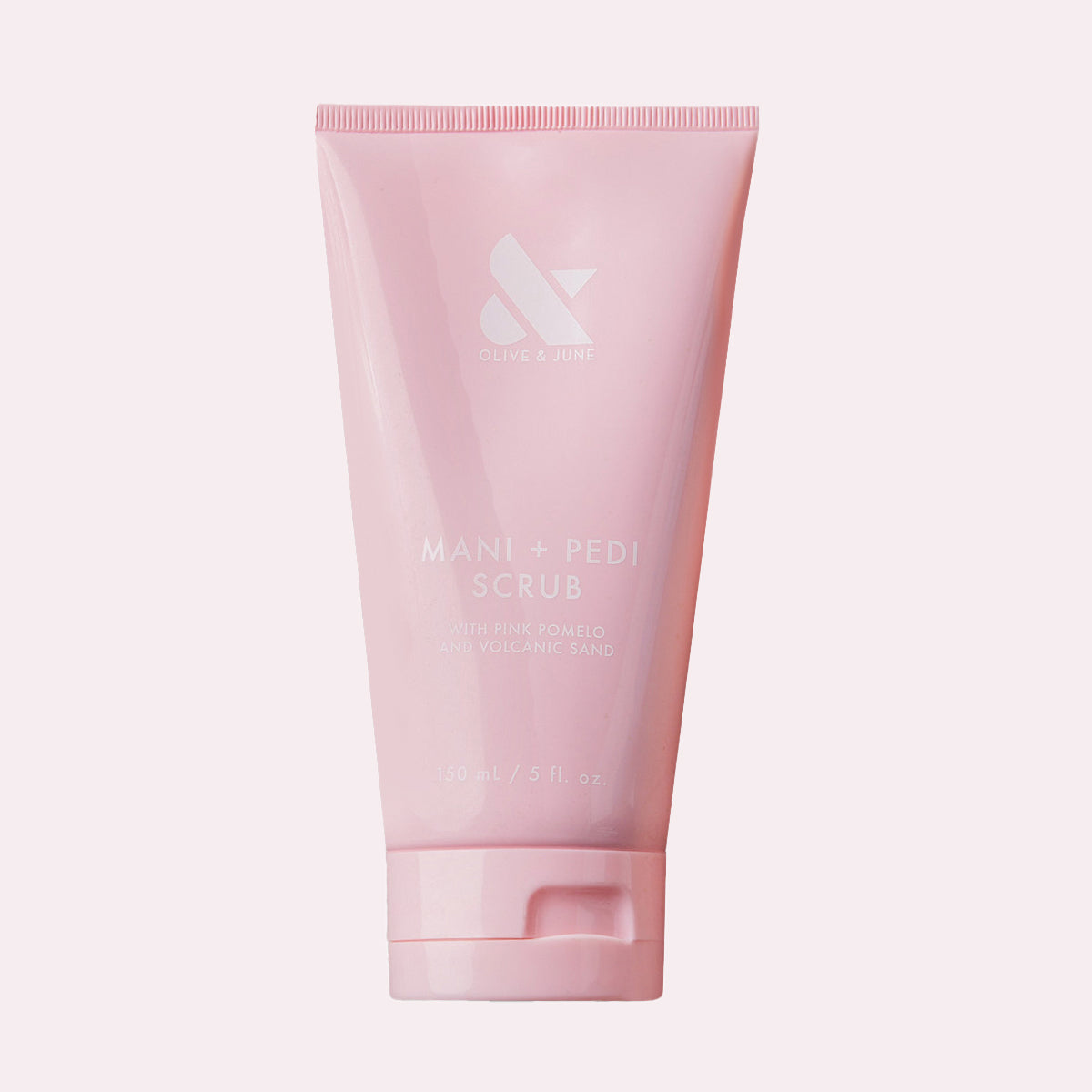 Pink tube of MANI + PEDI SCRUB with gentle exfoliating ingredients for soft, smooth hands and nails by Olive and June