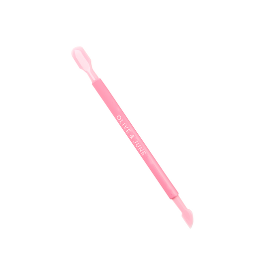 Mani Cuticle Pusher in pink with dual ends for gentle cuticle care and precise nail bed cleaning on white background