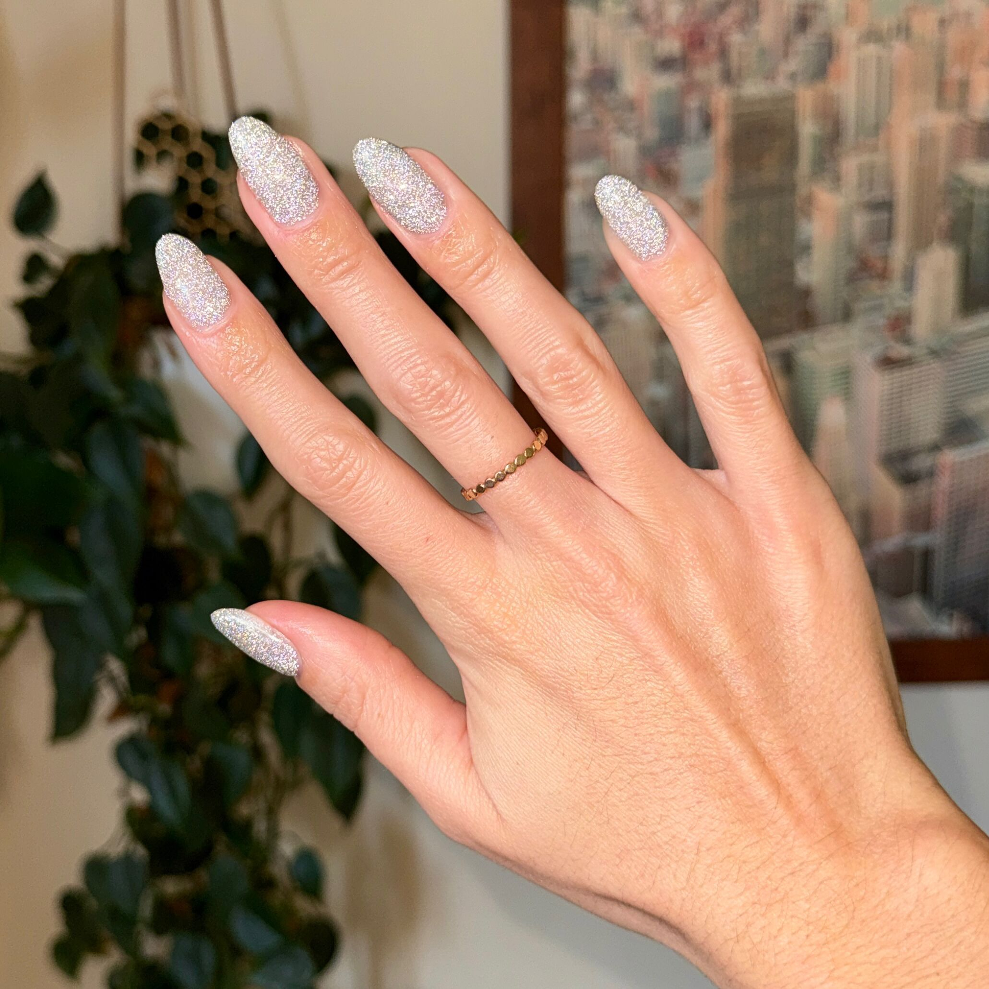 Mani on the Dance Floor Gel glitter polish on nails showing sparkling silver manicure for long-lasting wear