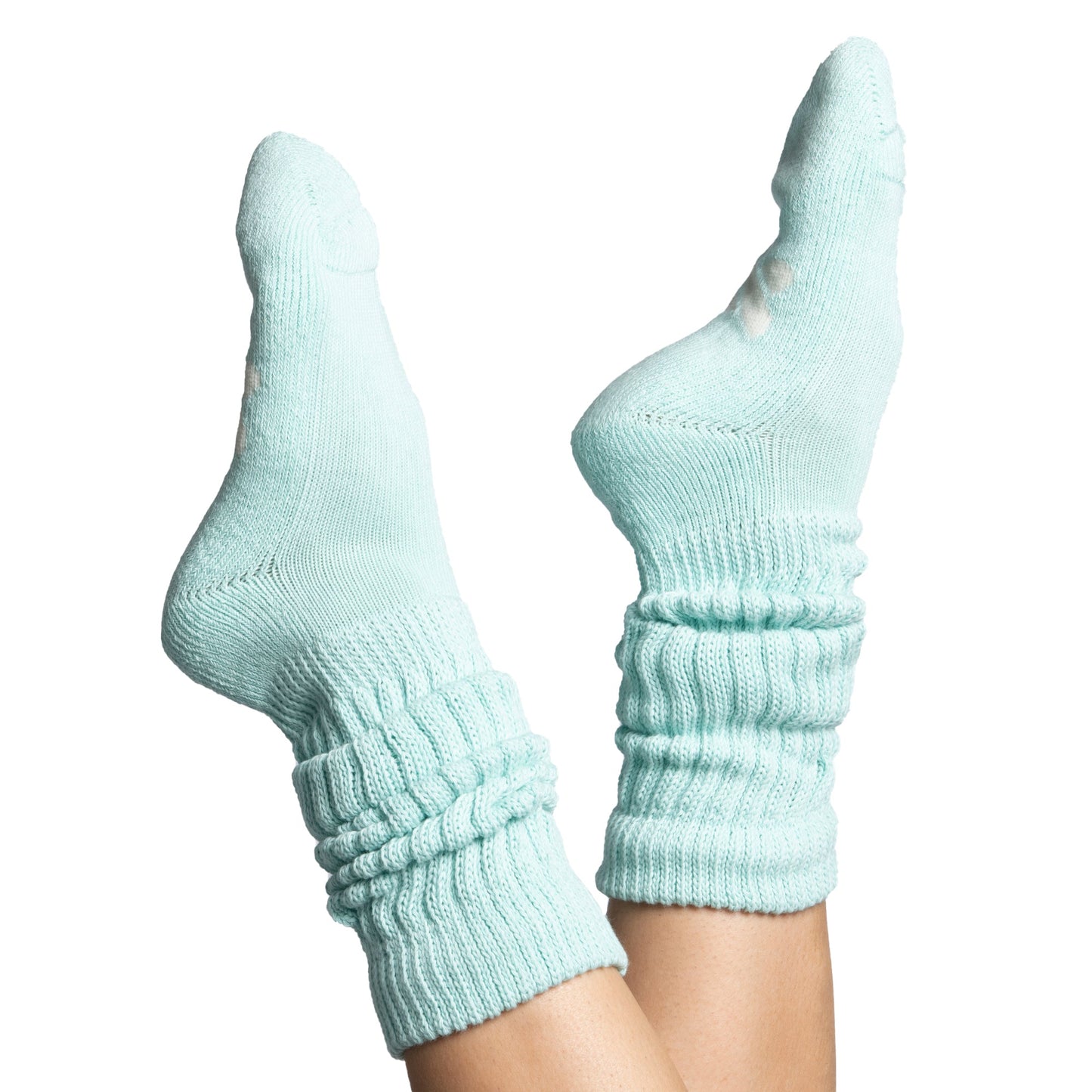 The Mint Slumber Party Set featuring soft mint green cozy socks designed for overnight foot hydration and care