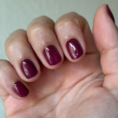 On the Promenade - Gel on short nails in shimmering mulberry purple for a glossy, long-lasting manicure by Olive and June