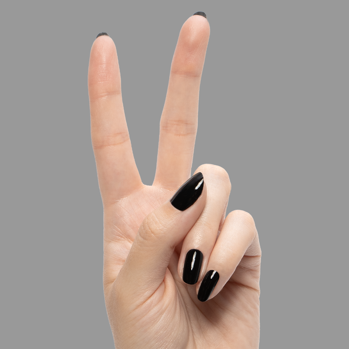 E+M - Gel shown on hand with deep black glossy nails for a sleek, long-lasting gel polish manicure by Olive and June