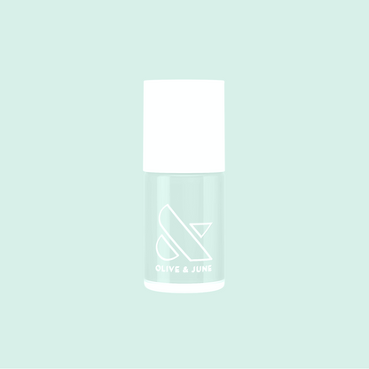 Sleeping Bag pastel mint green nail polish bottle by Olive and June on soft mint background for mani and manicure use
