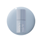 Vintage - Gel polish bottle in a classic denim blue shade on a matching blue gel polish background by Olive and June