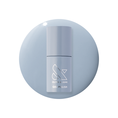 Vintage - Gel polish bottle in a classic denim blue shade on a matching blue gel polish background by Olive and June