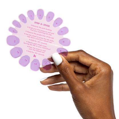 Super Stick Tab Pack showing hand holding adhesive nail tabs with printed step-by-step application instructions