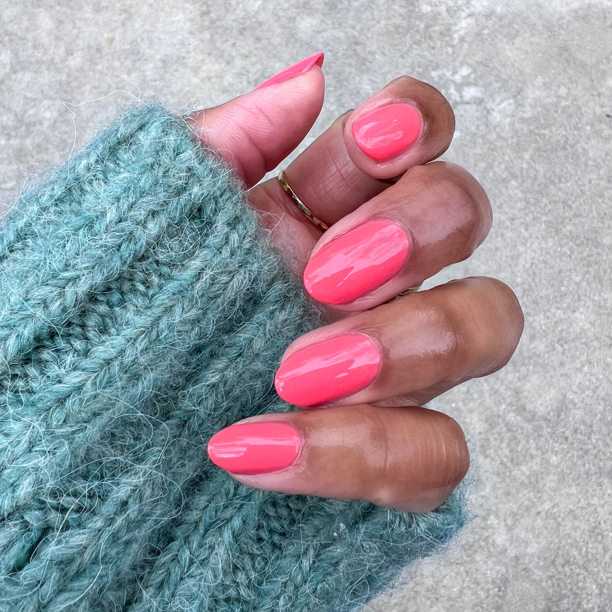 Perfect Pinwheel glossy coral gel polish on natural nails for a bright, long-lasting at-home manicure look