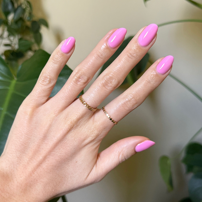 Permanent Vacation - Gel bright pink gel polish on almond-shaped nails for a vibrant, long-lasting manicure look