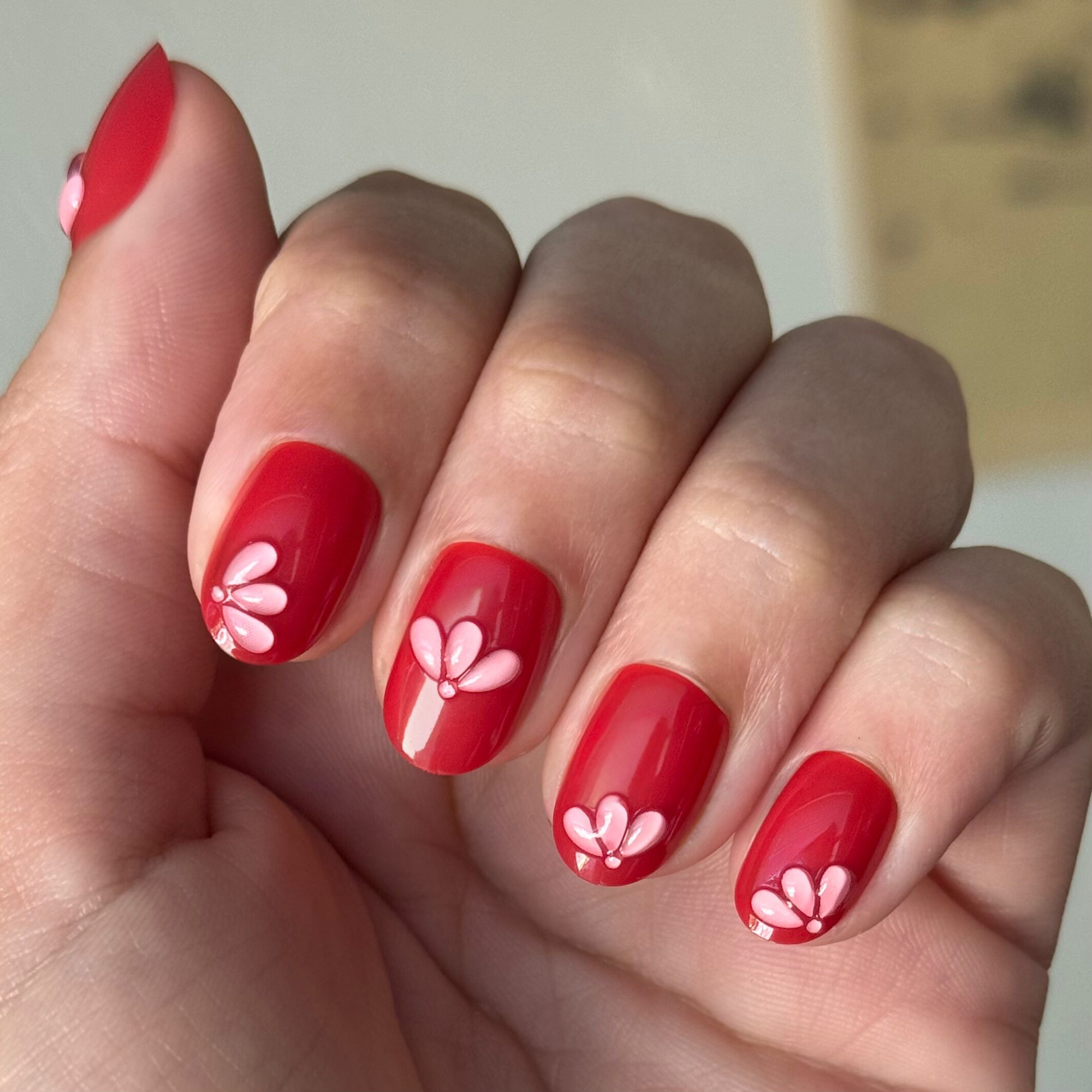 Puffy Pink Petals - Press-On | Extra Short | Round deep red nails with 3D pink petal design for quick at-home mani
