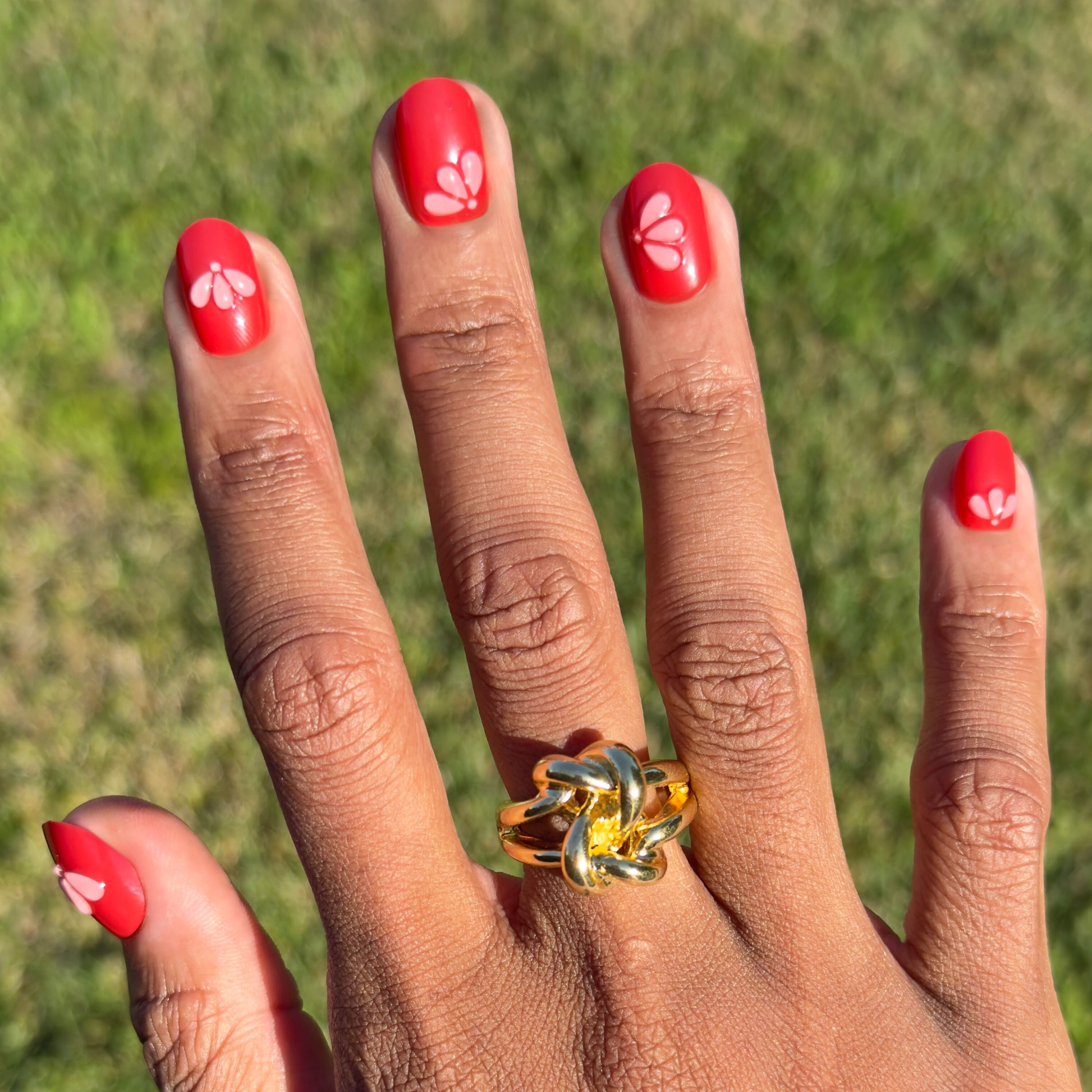 Puffy Pink Petals - Press-On | Extra Short | Round nails in bright red with subtle 3D petal details for easy at-home mani
