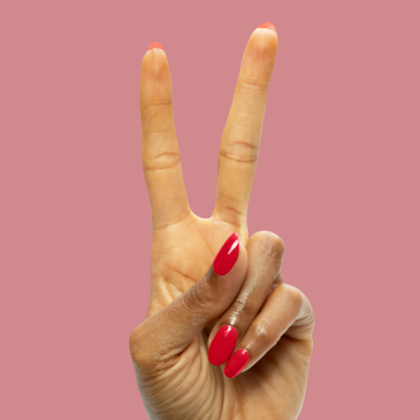 Secret Recipe - Gel smooth blue-toned red gel polish on nails shown in a glossy at-home manicure against pink background