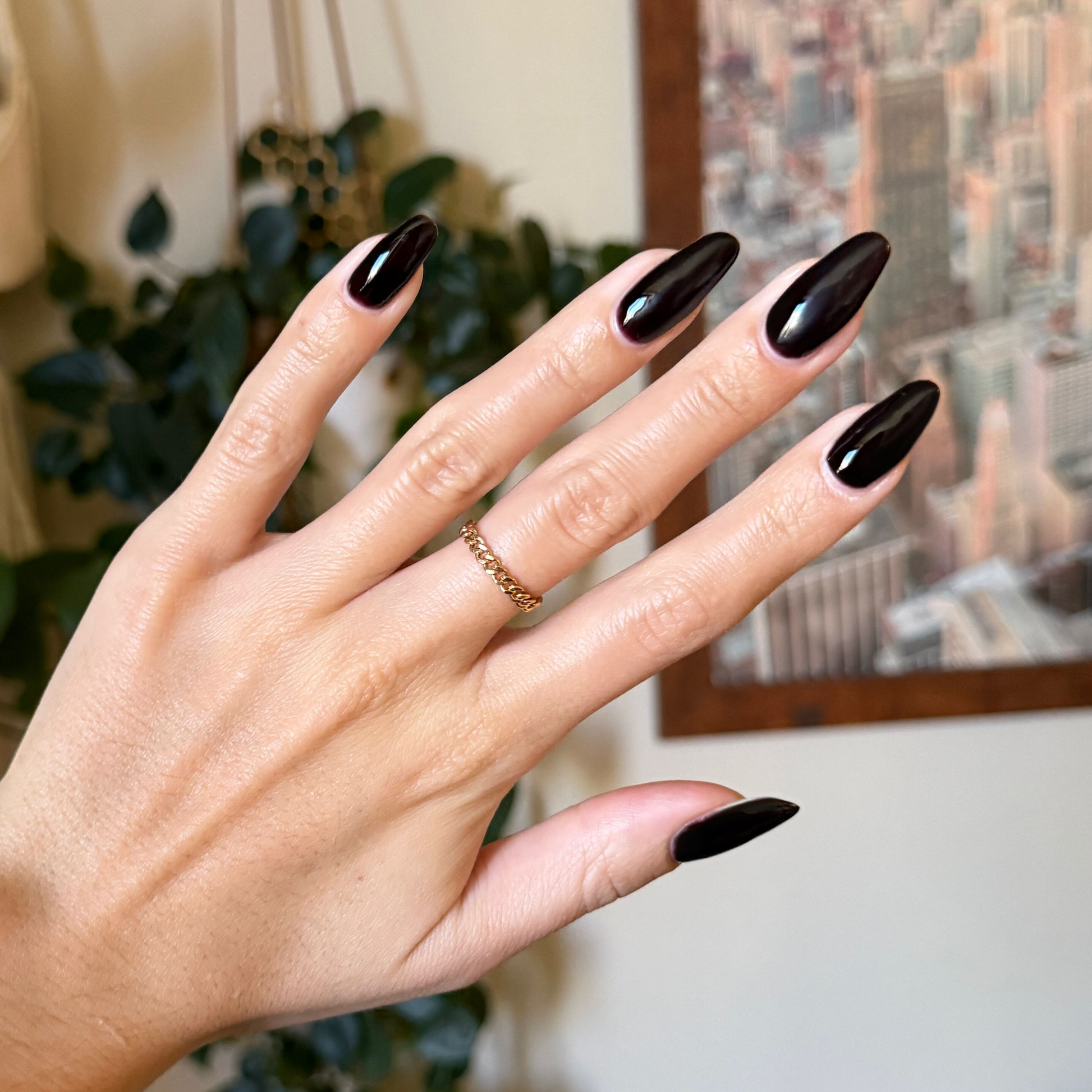 Shop Til You Drop Gel polish on long almond-shaped nails in a deep vampy red for a striking mani by Olive and June