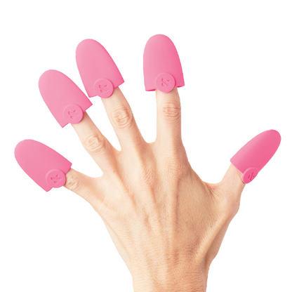 Hand wearing pink reusable caps from the Salon-Speed Soak-Off Kit for gentle at home gel polish removal