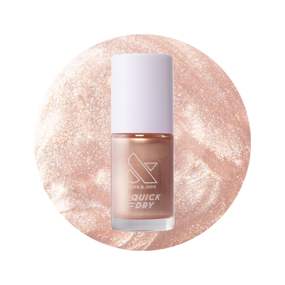 Olive and June Supernova quick dry gel polish bottle shown with shimmering sheer pink nail polish color background