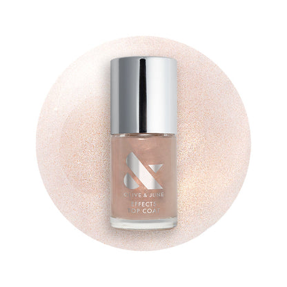 The Golden Effect Top Coat bottle with shimmering golden polish on a glossy swatch for radiant manicures