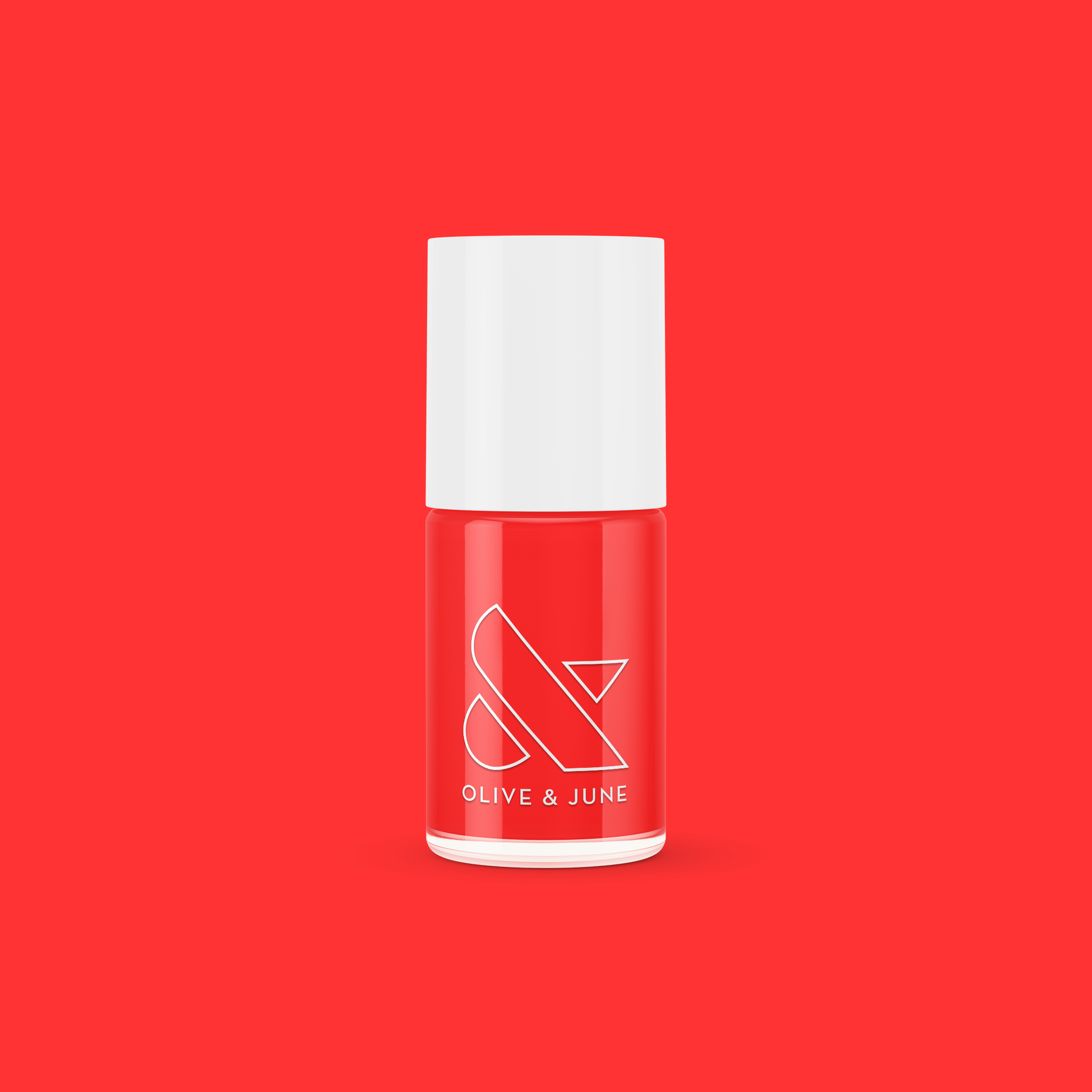 Lava nail polish bottle in vibrant spicy orange red from Olive and June against solid red background