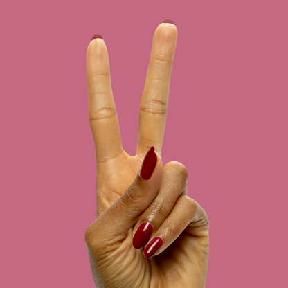 Mulberry - Gel deep maroon gel polish on natural nails showing a glossy, long-lasting manicure by Olive and June