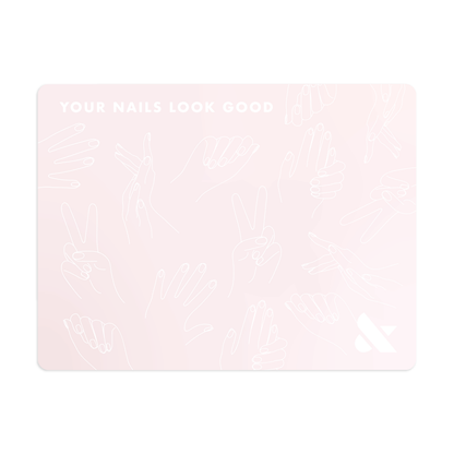 Silicone Painting Mat in soft pink with line art hands and "Your Nails Look Good" text for manicure workspace protection